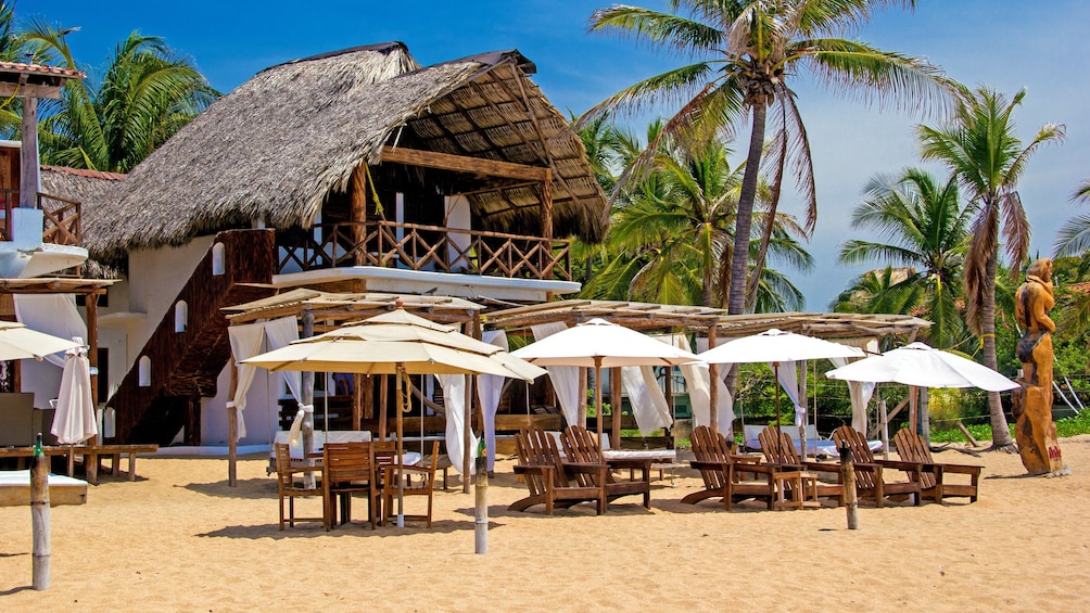 Tables, chairs, and umbrellas on a Mexican beach