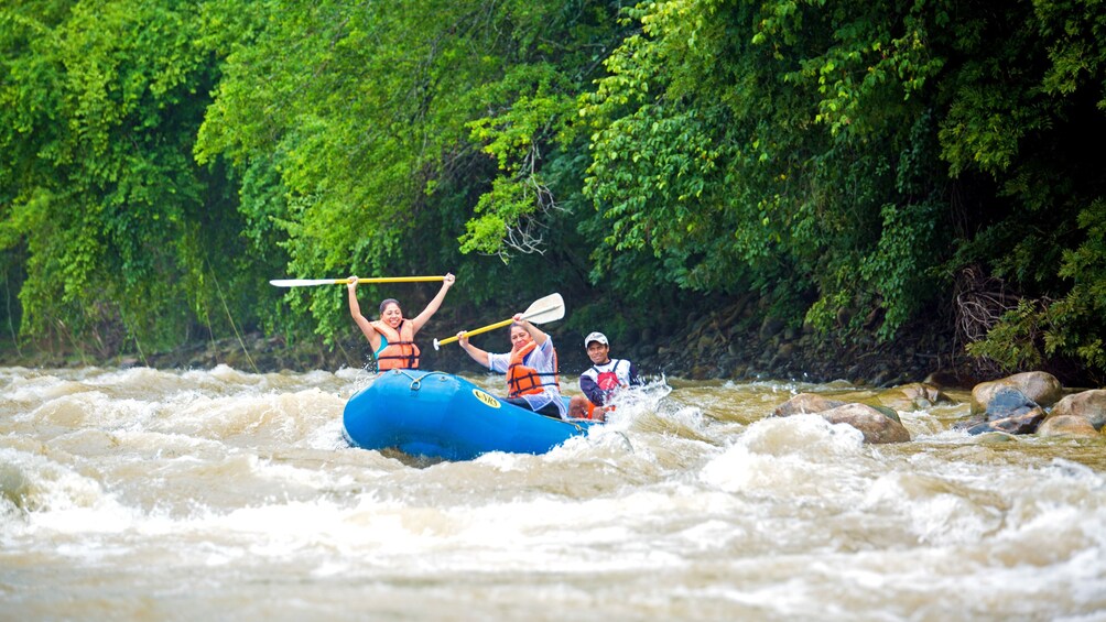 Three rafters ride the rapids on Rio Copalita