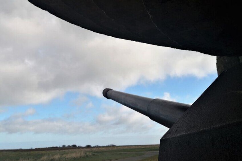 LONGUES SUR MER (German 150mm marine gun housed inside bunker and gun tube pointing towards the English Channel) 