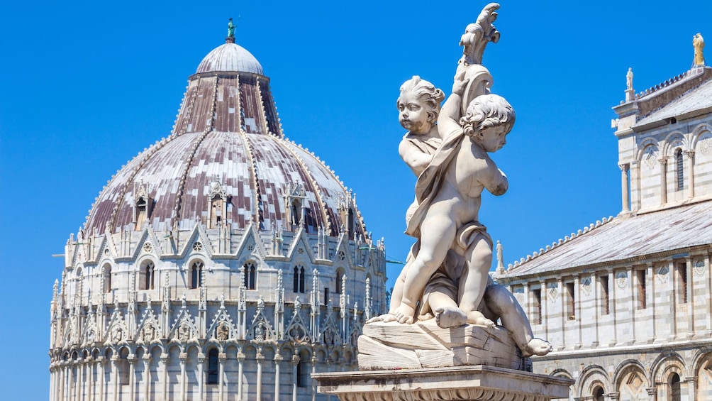 Baptistry and Angel statue in Pisa