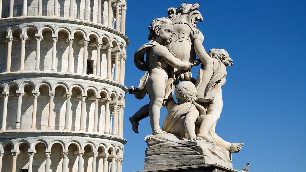 Close up of sculptures in front of Pisa.