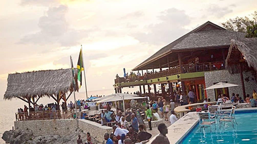 View of the pool and people at Rick's Cafe in South Coast