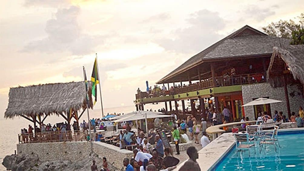 View of the pool and people at Rick's Cafe in South Coast 