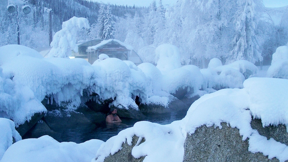Man soaking in the hot springs in Fairbanks