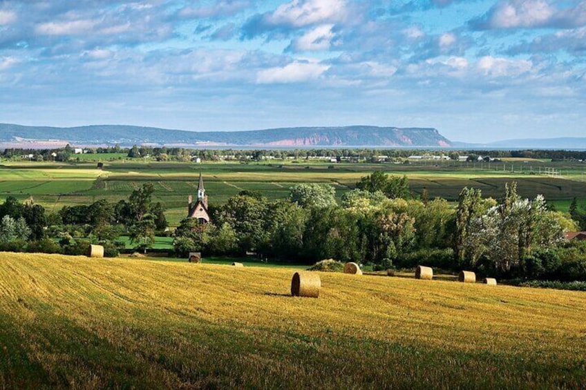 Spectacular view of Grand Pre Church and Cape Blomidon from Old Post Road