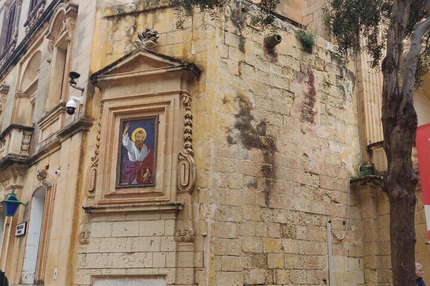 Painting of St Paul on the street walls of Mdina