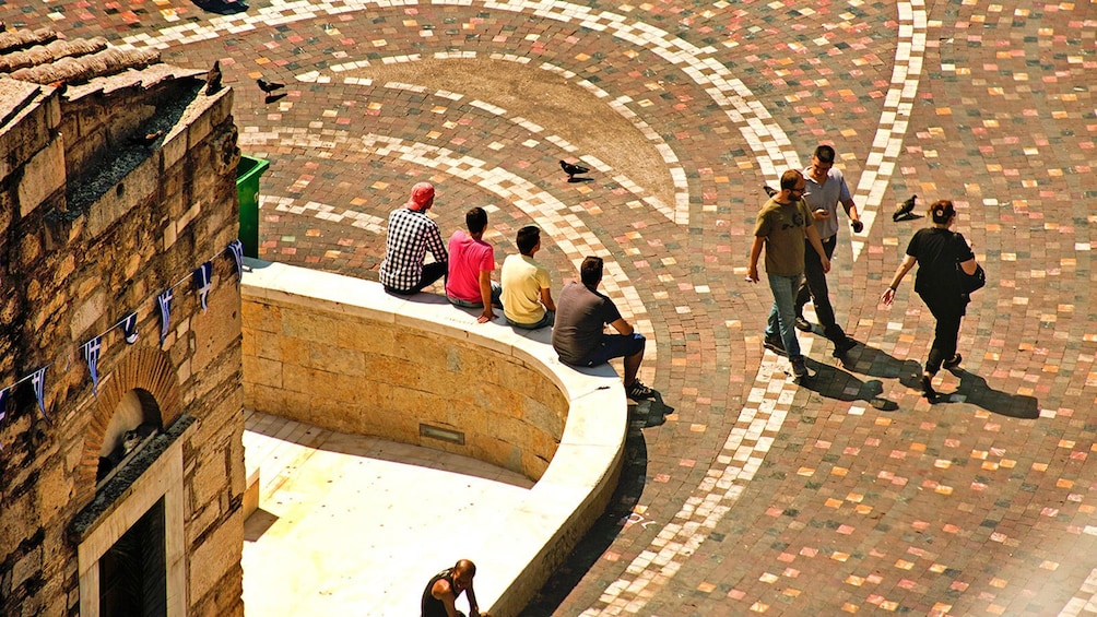 Aerial view of courtyard with people lounging.