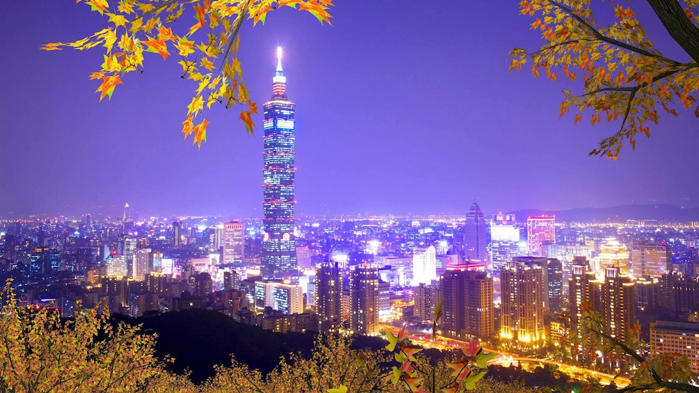 Show item 4 of 6. Purple skies overlooking the city at night in Taipei