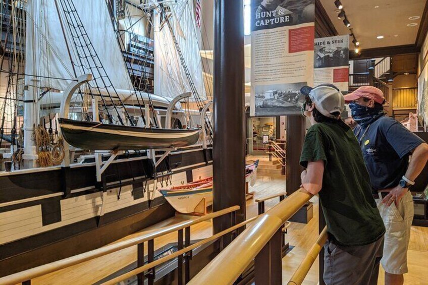 Visitors admire the Lagoda, a half-scale model of a 19th Century whaleship and the largest model ship in the world.
