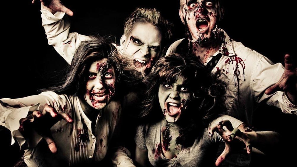 Group shot of men and women in zombie costumes.