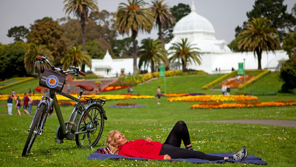 Woman lying on grass in San Francisco park