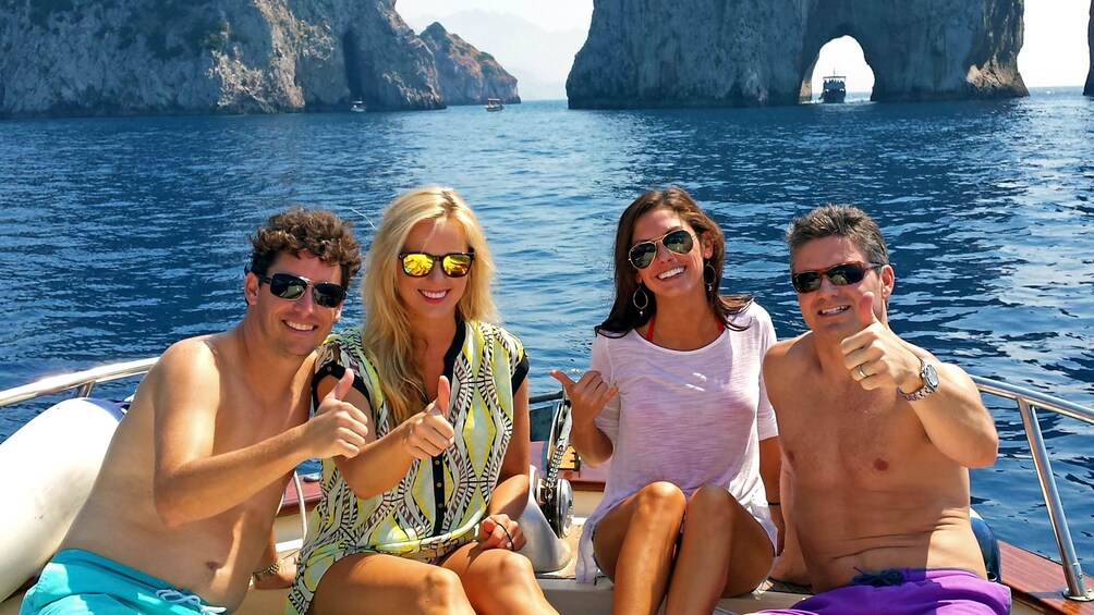 couples sitting at the back of a boat in Italy