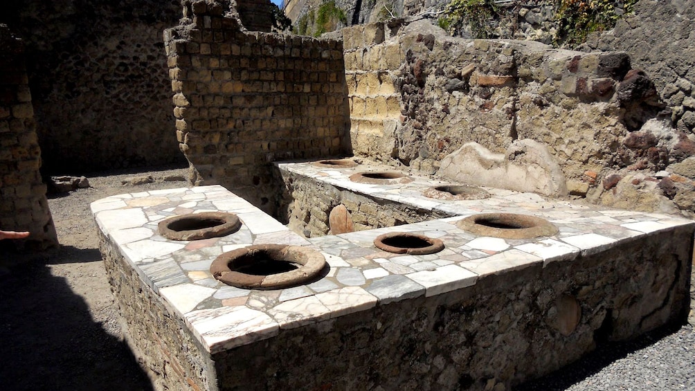 Apri foto 3 di 8. The remnants of a stone bathroom in the ruins of Herculaneum