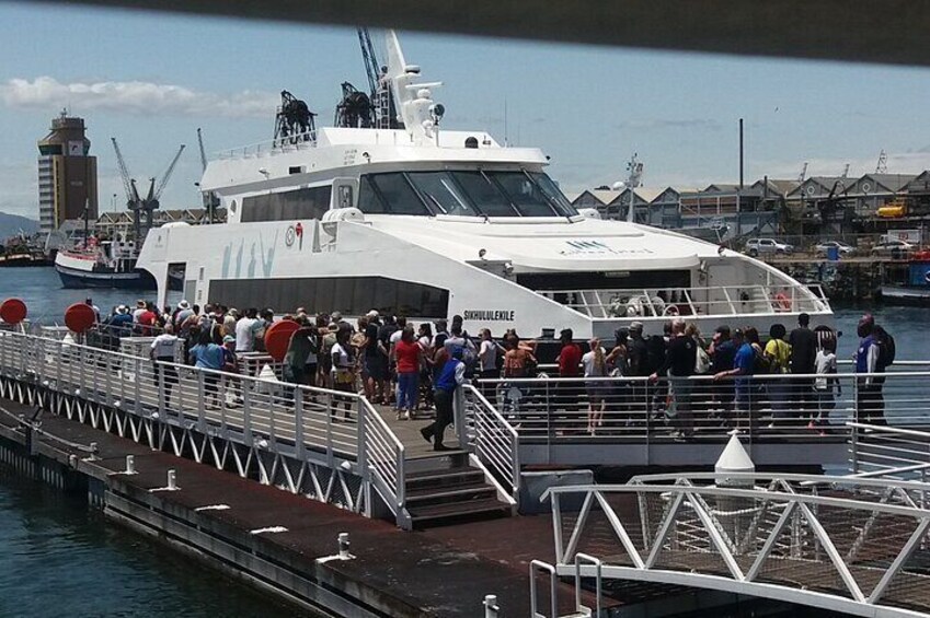 Travelers board the ferry