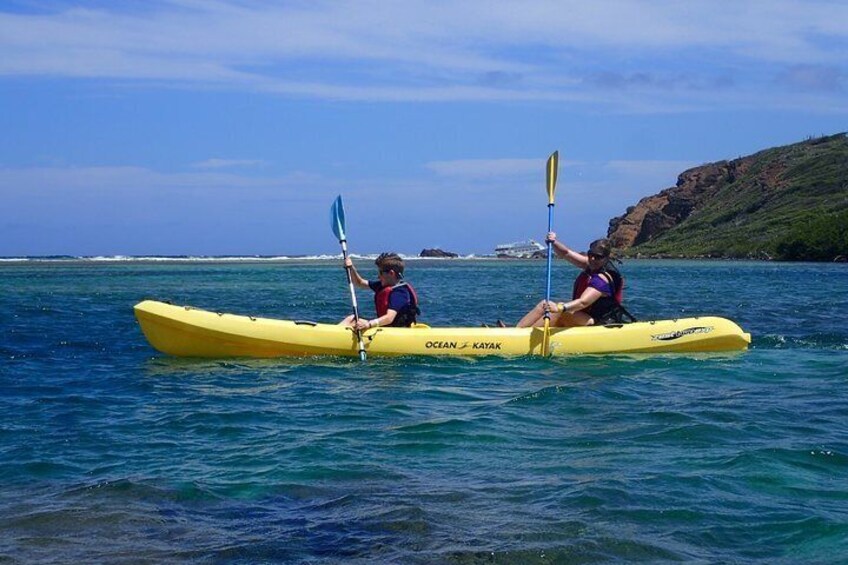 Paddling in the crystal clear lagoon in the protected waters behind False Entrance next to Cas Cay.