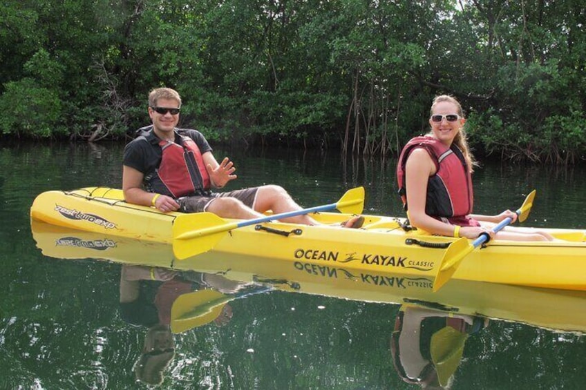 Paddling through tunnels and waterways in a romantic shallow calm and quiet lagoon.