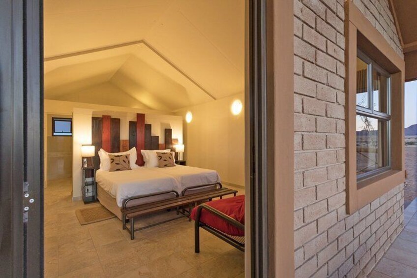 Sleep well in your air-conditioned en-suite room in the desert.