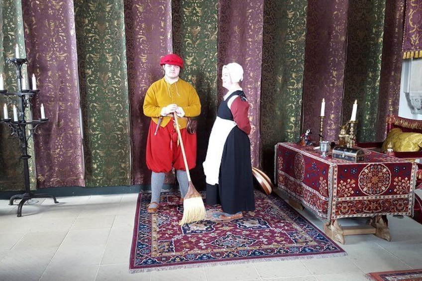 Costumed actors in the Queen's Bed Chamber