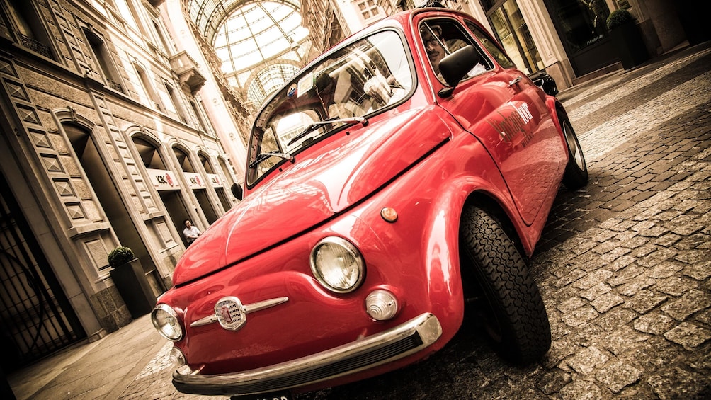 Show item 1 of 5. small Fiat car parked on the stone road in Italy