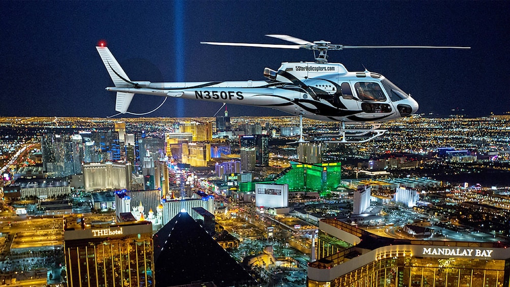 Helicopter flying over Las Vegas at night