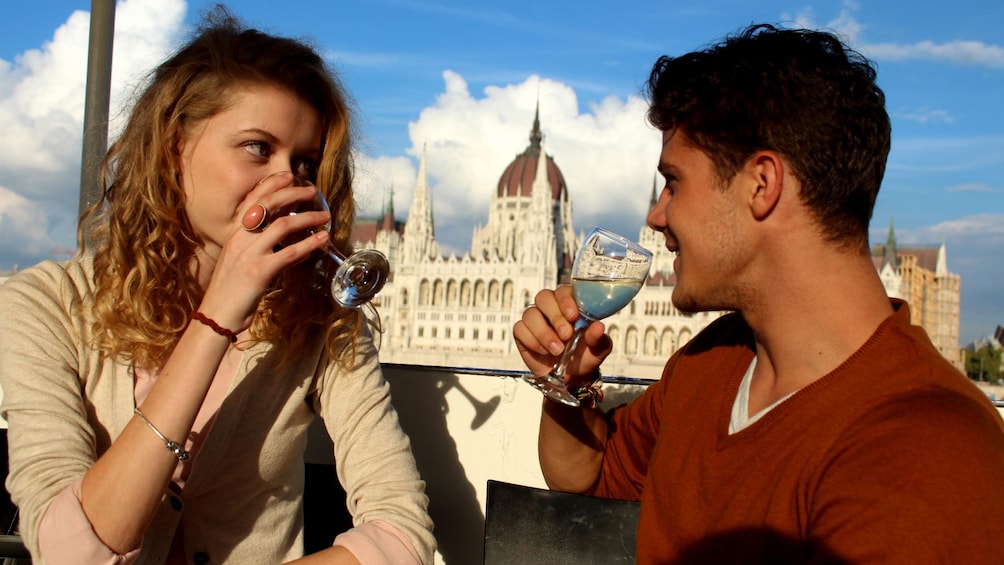 Man and woman drink white wine 