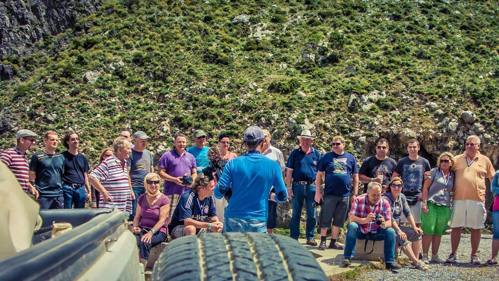 guide leading a large group in Greece