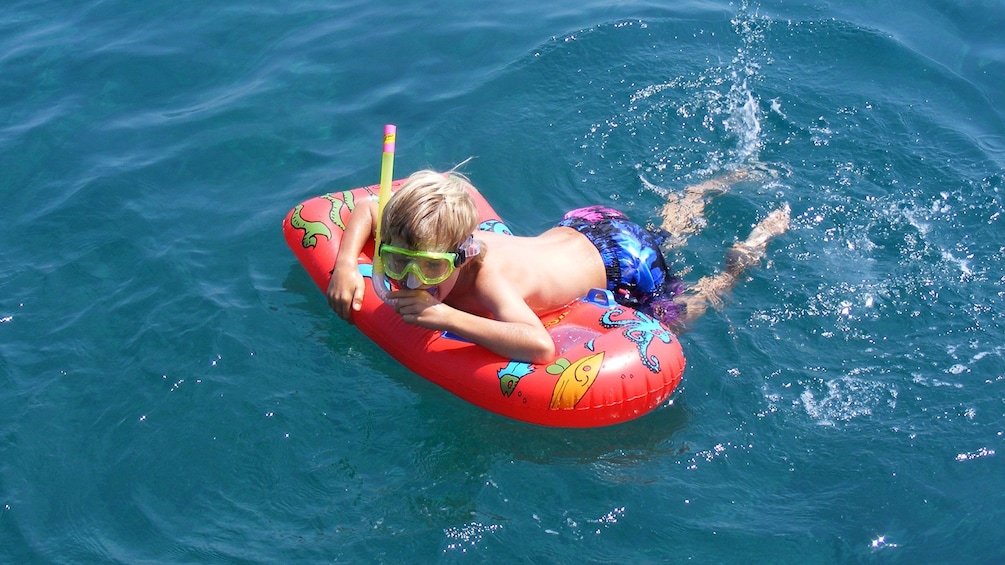 Young boy snorkeling in Crete Island