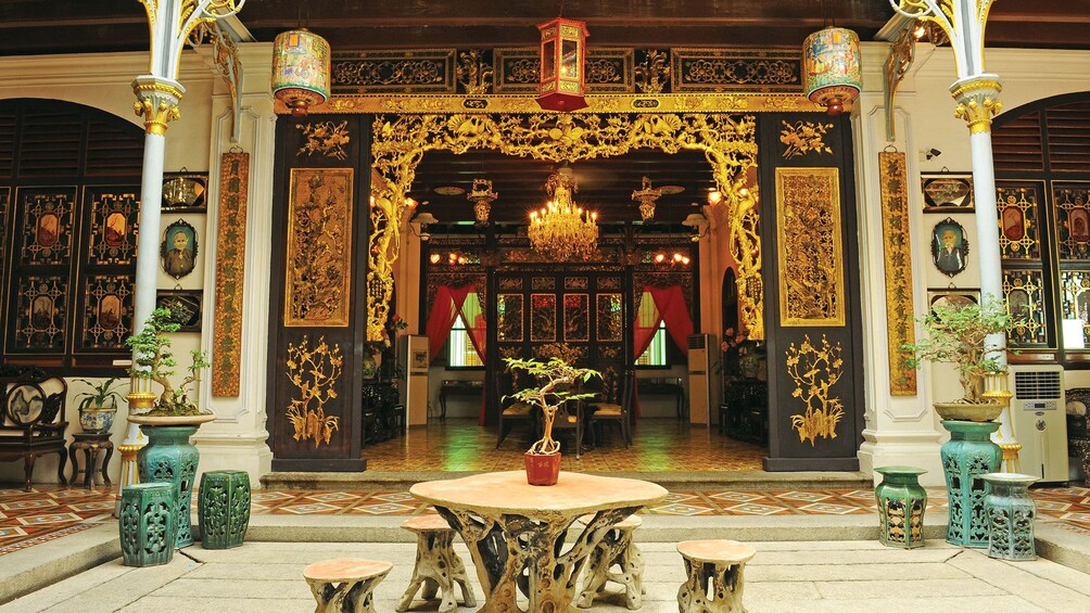 Ornately decorated and golden interior of Pinang Peranakan Mansion in Penang