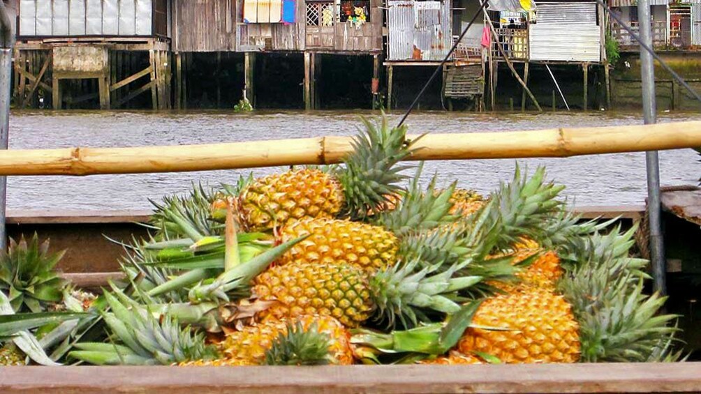 A pile of Pineapplesin a boat in the Cai Be floating Market