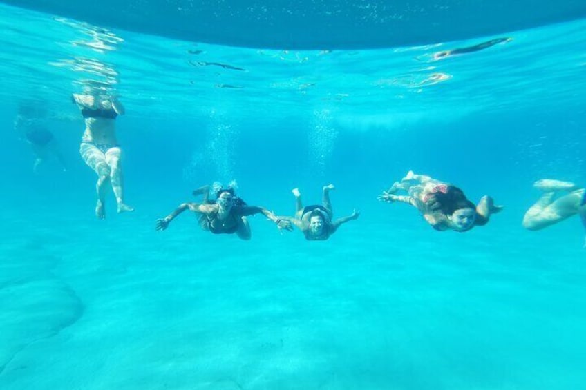 Swim with us and have your friends and family capture this from the glass bottom!