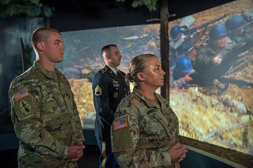 Servicemen and Servicewomen exploring the Charles Coolidge exhibit at the National Medal of Honor Heritage Center.