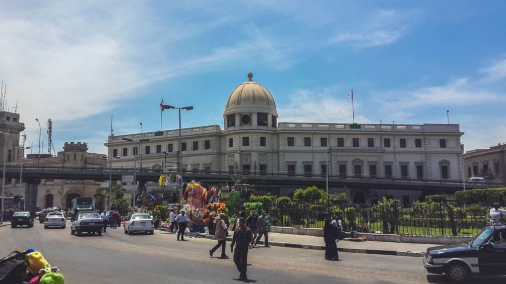 Street view of city with structure in the distance.