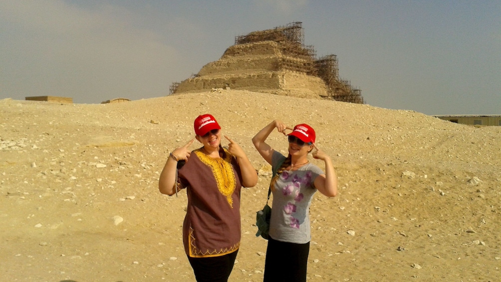 Pair of women with pyramid in the background in Memphis