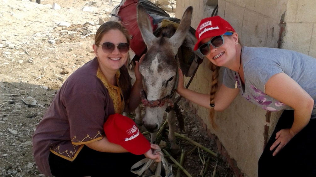 Pair of women posing with a donkey in Memphis