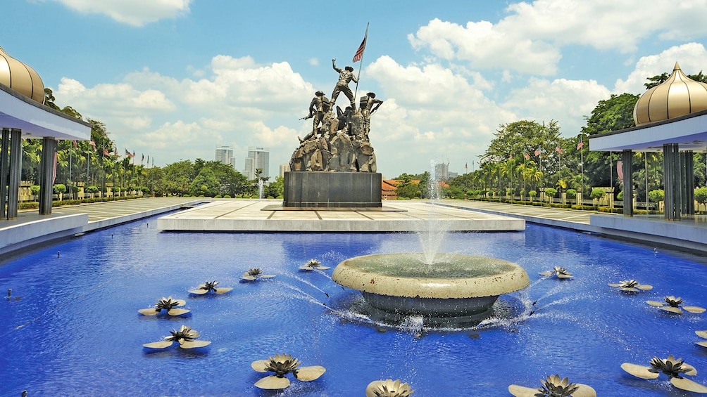 a water fountain inside a pond in Kuala Lumpur