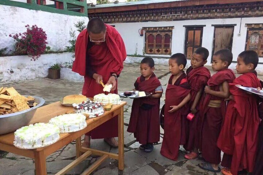 Little Monk Happy To Receive Treat From Guest