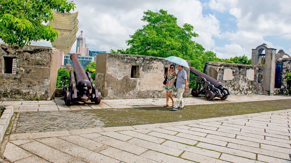 Show item 3 of 5. couple taking a leisurely stroll in Macau