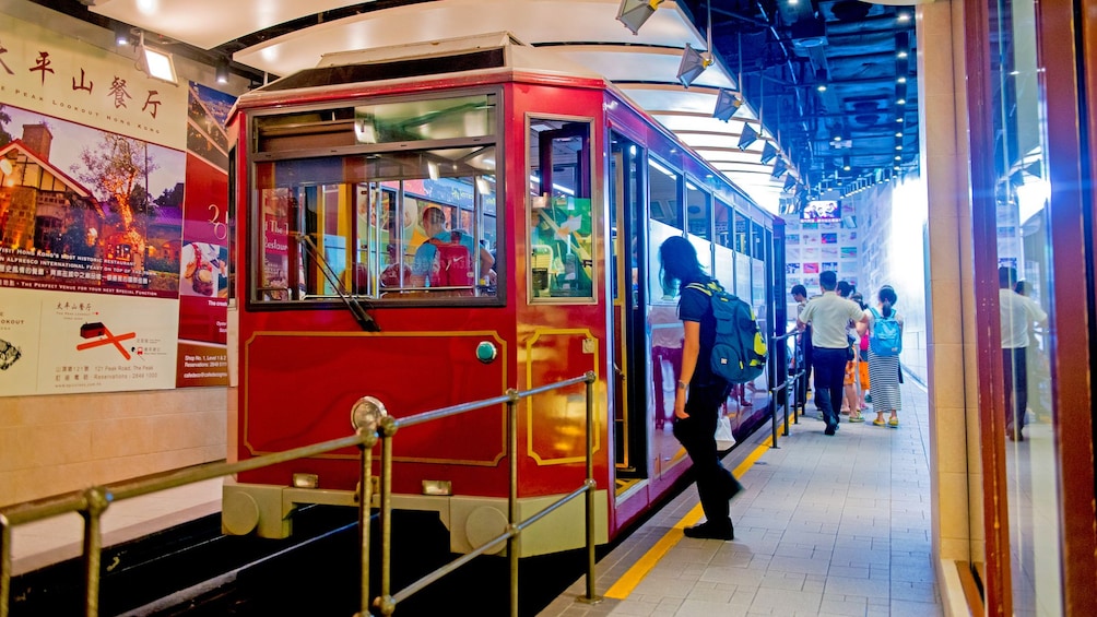 Show item 4 of 10. aboard a small rail car in Hong Kong