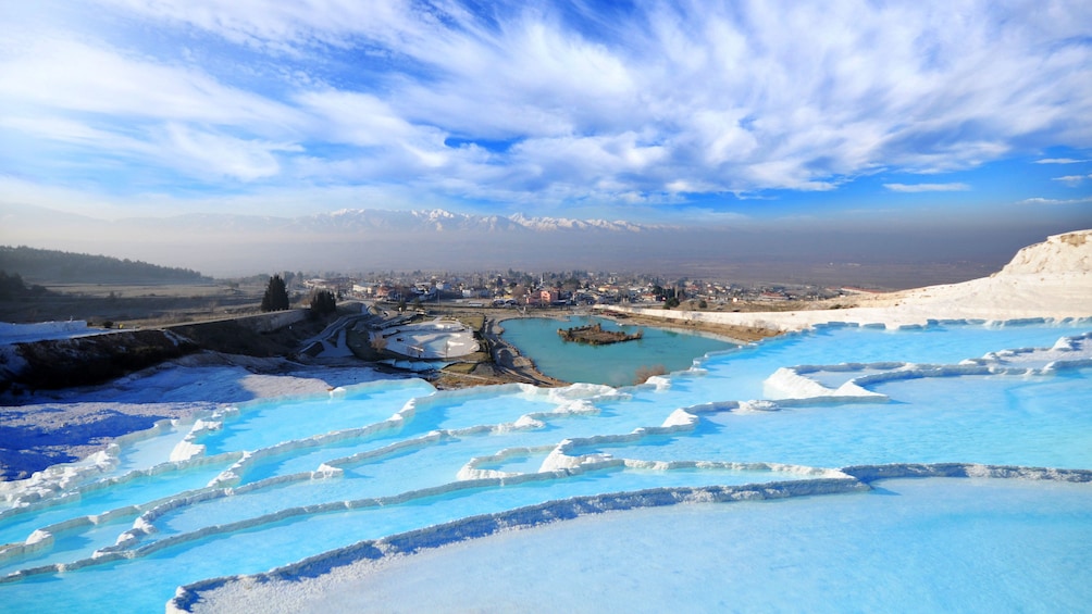 Hot springs with city in the distance in Pamukkale