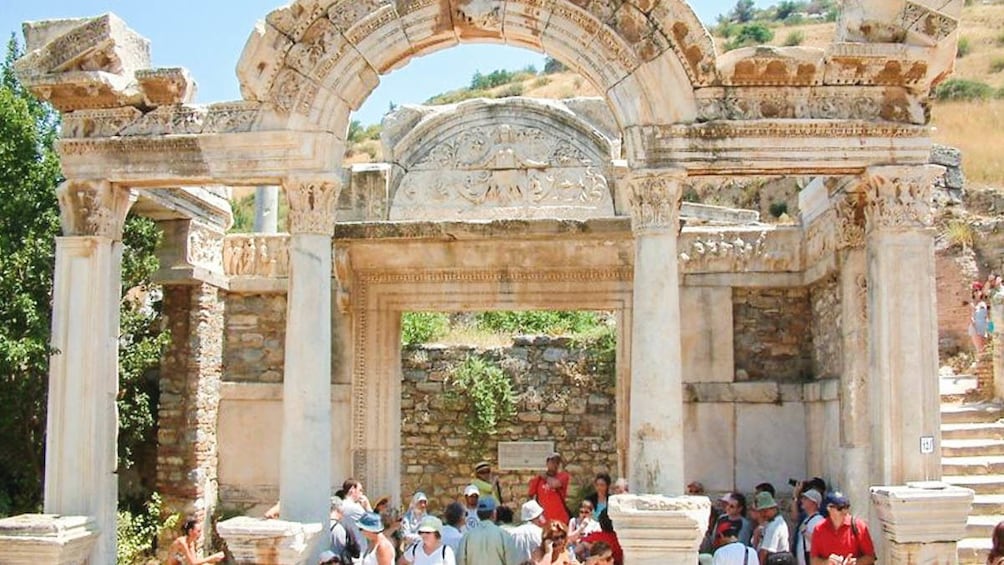 Front view of church ruins with several observers.