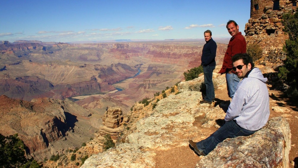 Group of men on the edge of the Grand Canyon