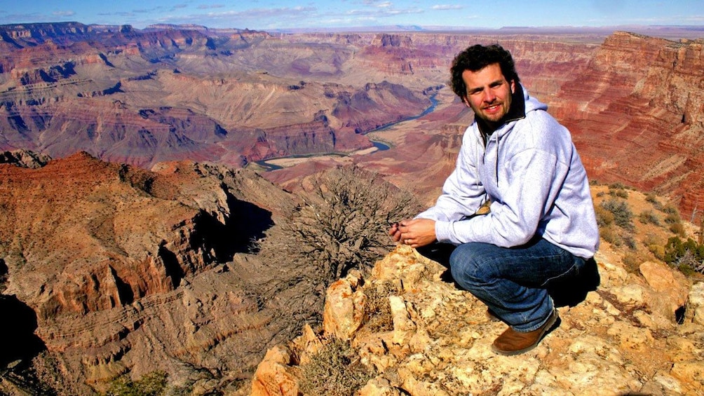 hiker on top of the mountain at the Grand Canyon