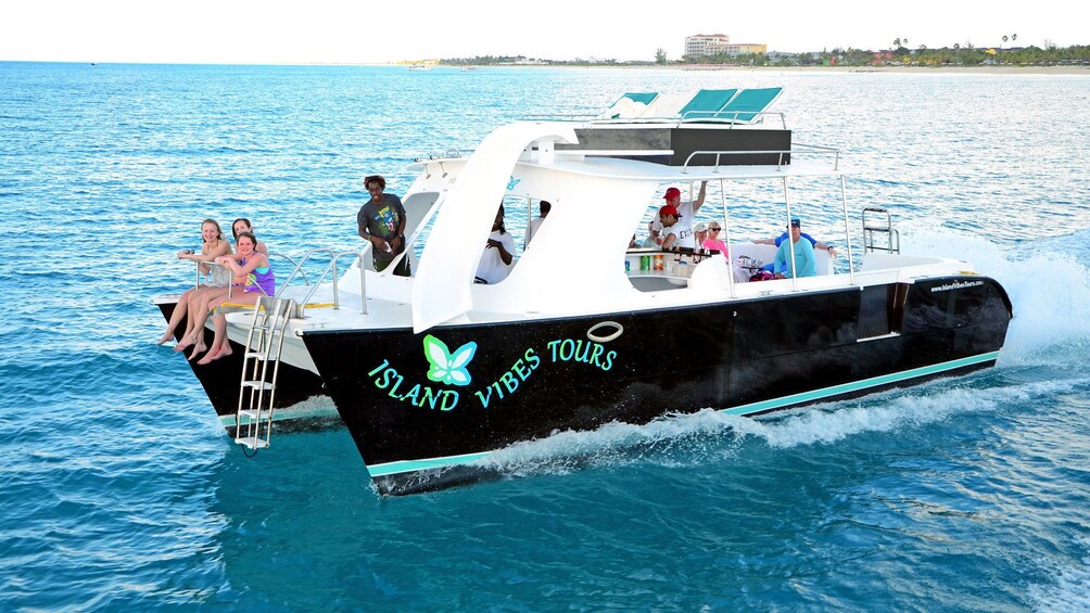 Show item 1 of 5. passengers on a catamaran in Turks and Caicos