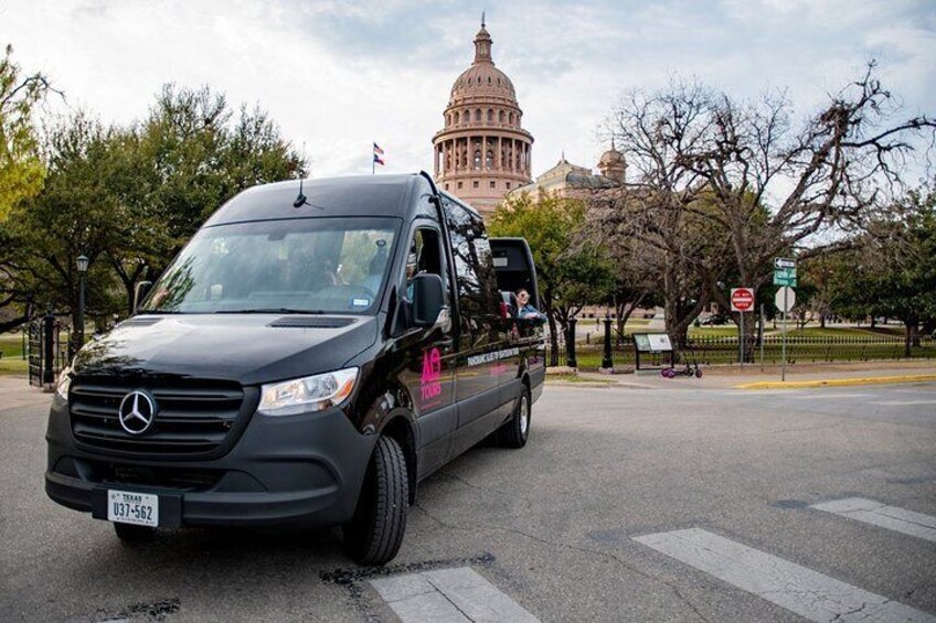 The AO Tours Austin Panoramic Mercedes Mini-Bus in front of State Capitol