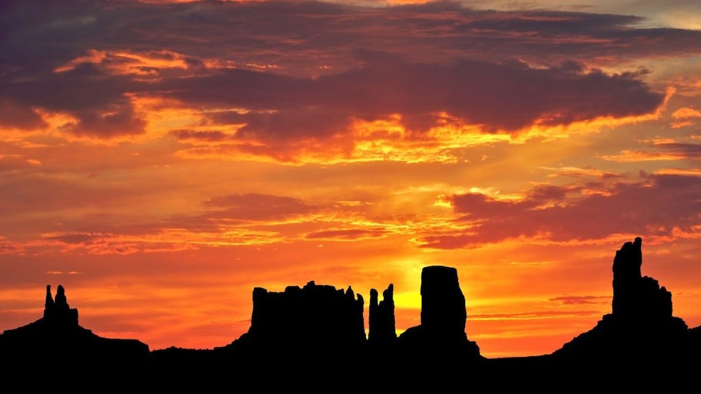 A silhouetted monument park at Sunset