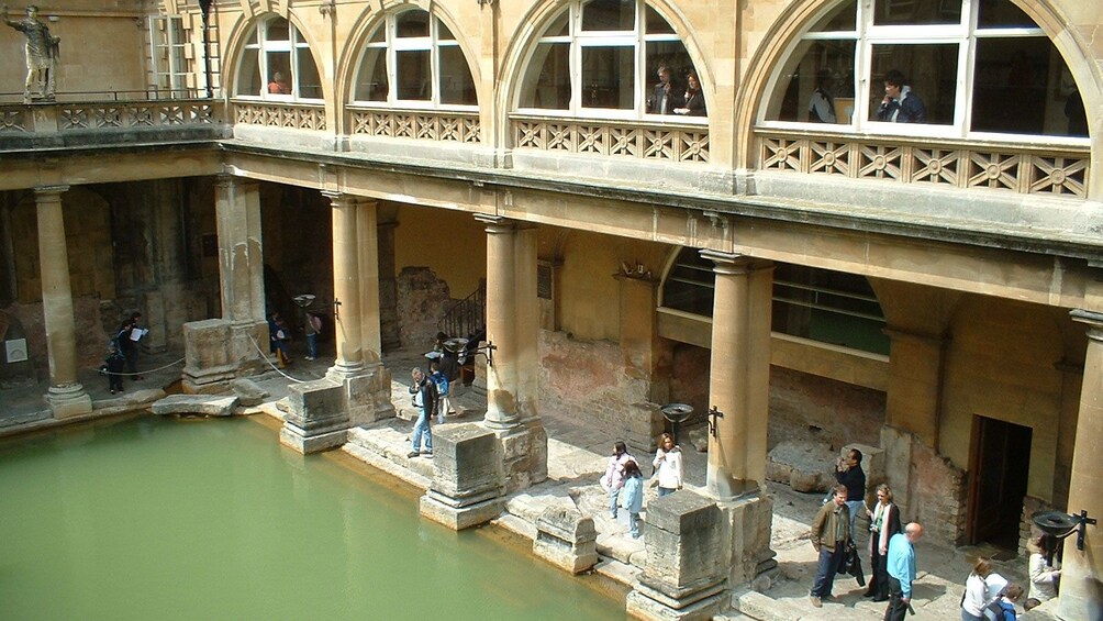 Visitors looking at the Roman Baths