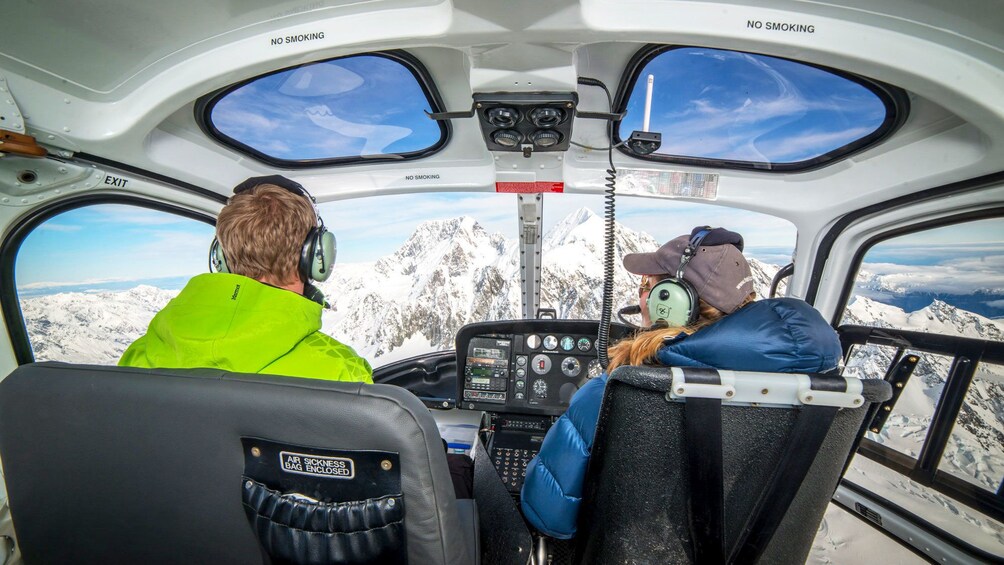 View from inside helicopter as it travels to mountains from Queenstown