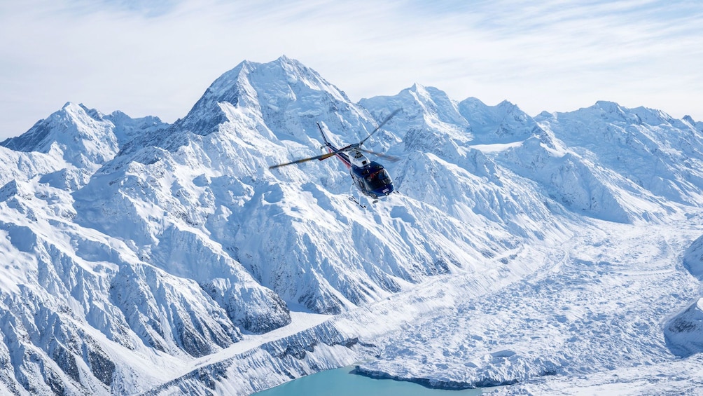 Helicopter flying over glacier and Mount Cook in Queenstown