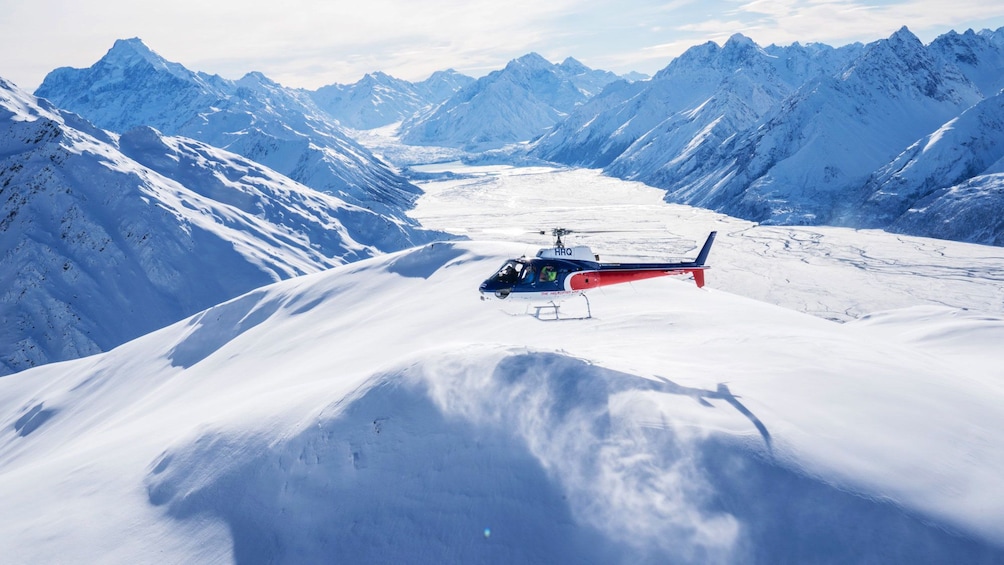 Helicopter coming in for landing on snowpack in Queenstown