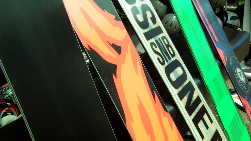 Show item 3 of 6. a variety of snowboards at the rental in Whistler